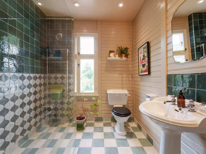 The three bathrooms have a contemporary design.