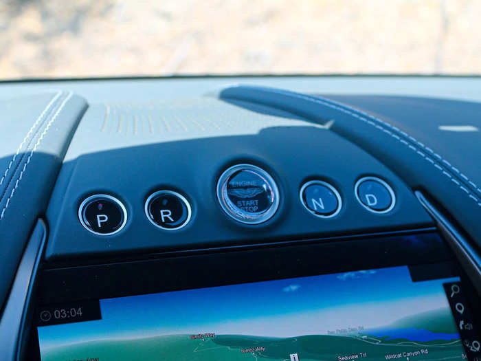 I instinctively reached down just about every time I wanted to select a gear. But you get into drive, park, or reverse using a series of glass buttons. on the dashboard. 