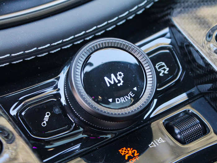 It provides several drive modes, which you can scroll through using a dial in the center console. The sportier settings lower the car, stiffen up the suspension, and make gear shifts more aggressive. 