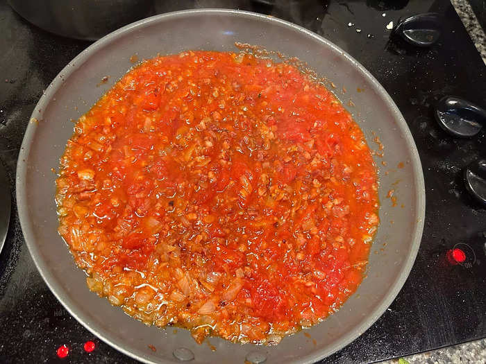 I let my sauce simmer uncovered over medium-low heat.