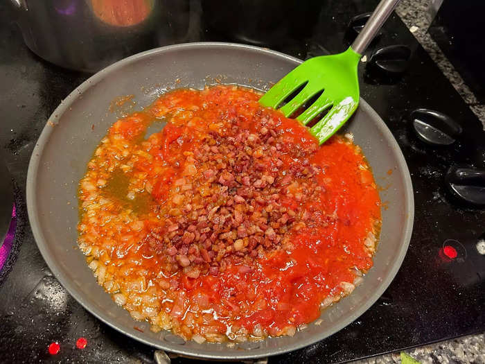 I added the crushed tomatoes and threw the pancetta back into the pan.