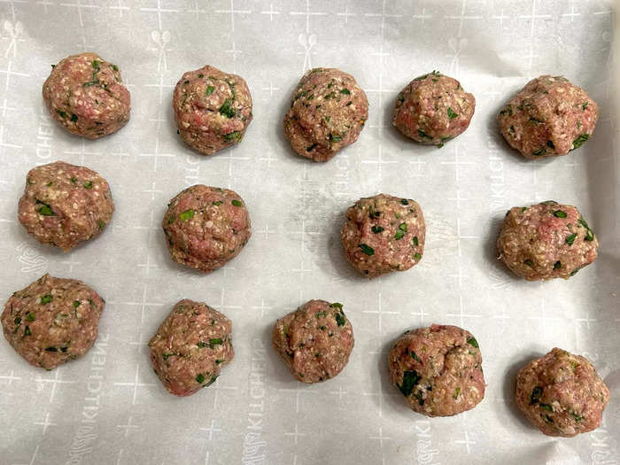 I placed my meatballs on a baking sheet lined with parchment paper and threw them into the oven.