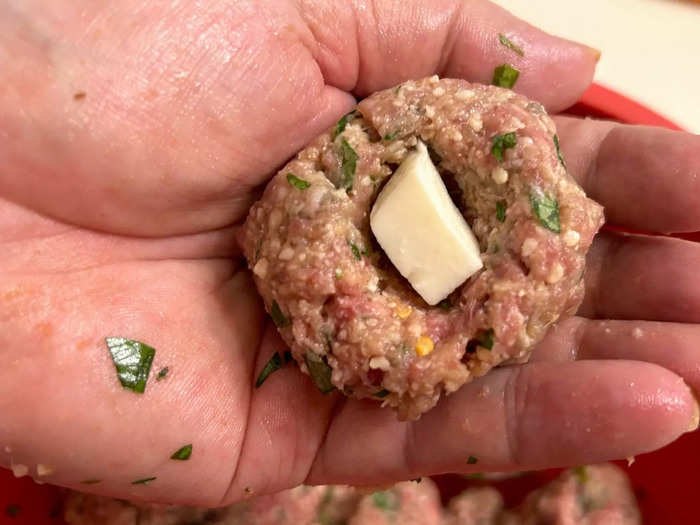 I placed a cube of cheese in the center of every meatball.