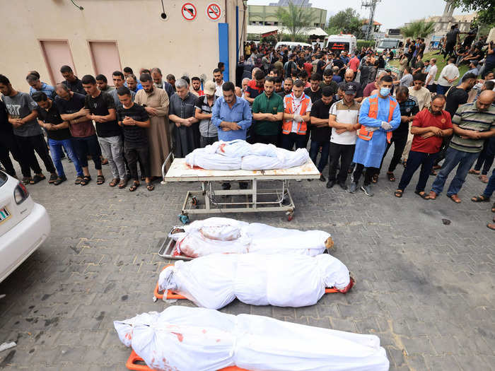 Palestinians pray over the bodies of those they have lost in Gaza.