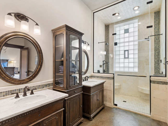 The residence features updated styles, such as this bright, tiled bathroom.