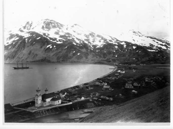 Late 1800s: This is the town of Unalaska, on the island of the same name. It is still the main population center of the Aleutian Islands.