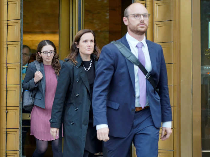 Ellison wore a mauve dress paired with dark stockings to court on Tuesday.