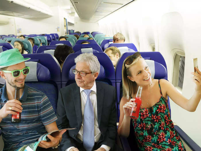 3. Talking to other passengers or being a chatty seatmate.