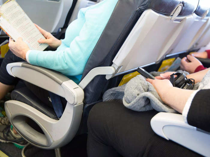 6. Using both armrests of your seat.