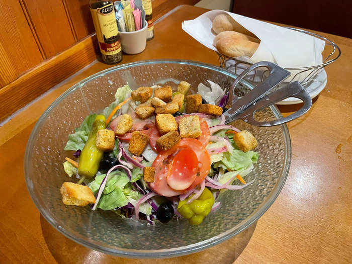 At Olive Garden, we started with the house salad and breadsticks that came free with an entrée.