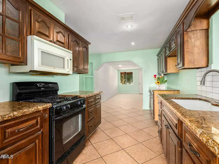 The kitchen has granite countertops and is also painted in the rest of the home