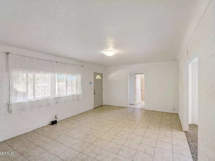 The living room is pretty bare-bones, but it offers a blank slate with its neutral colors.