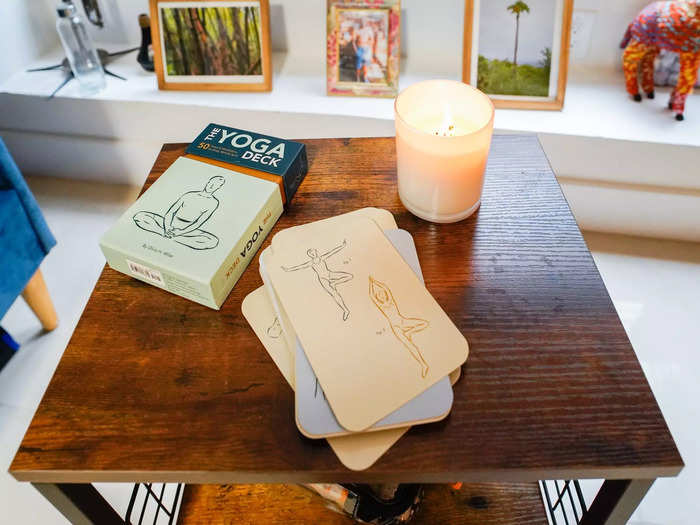 The deck is full of cards that show and explain how to do yoga poses.