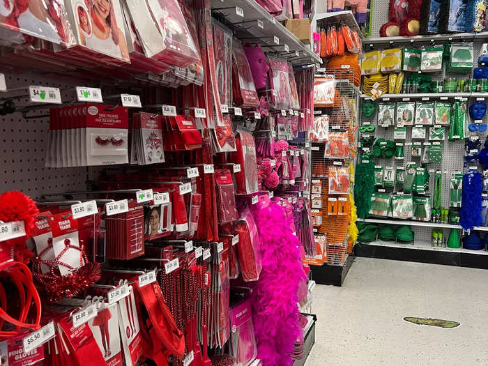 Another aisle was totally organized by color. There were wigs, beads, fake eyelashes, tiaras, earrings, masks, boas, and more.