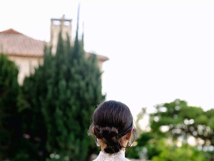 The back of the bodice was lined with pearl buttons, nodding to more traditional bridal looks.