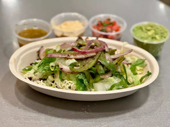 Chipotle prices its bowls by the type of protein you select. I ordered mine with carne asada, a premium protein available for a limited time only.