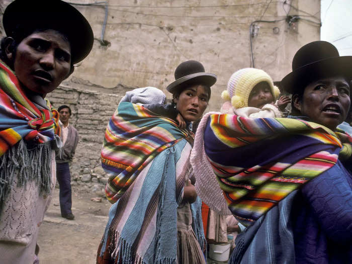 The traditional clothing of the Cholitas originates from Spanish colonizers in the 17th century.