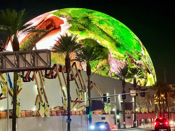 When I walked up for my $58 nighttime show, the Sphere was cycling through colorful displays of greens, blues, and purples.