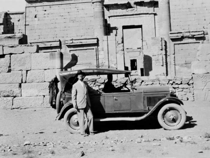 1925: A tourist poses outside of the Temple of Ramesses III, a pharaoh who ruled from 1186 to 1155 BCE, in Medinet Habu.