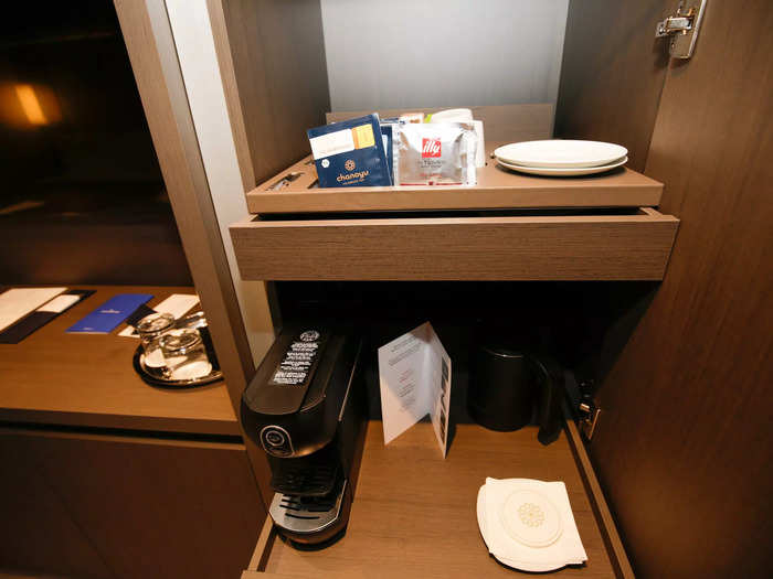 The adjoining coffee table displayed my suite’s complimentary bottle of Veuve Clicquot and a large MSC-branded cookie.