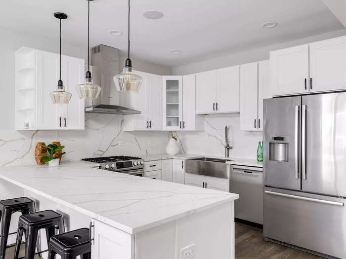 The all-white kitchen lacks personality.