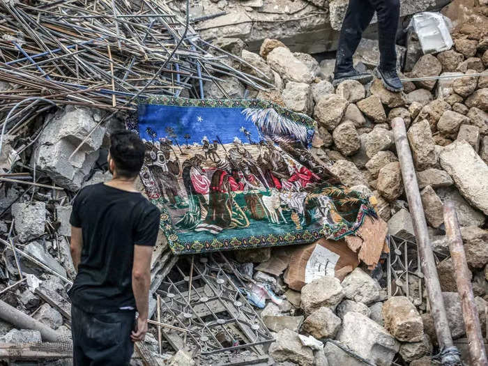 Debris littered the grounds of the church as search-and-rescue teams looked for survivors.