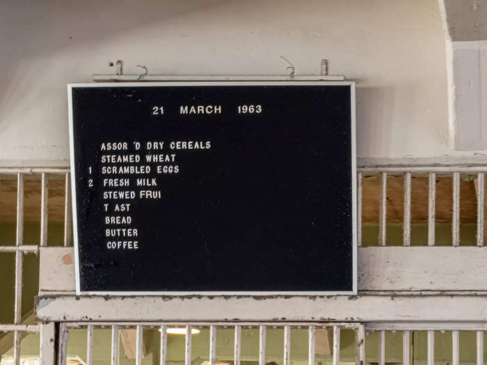 Public Health Service nutritionists helped create meals for the people inside the prison. A 1963 breakfast menu on display shows they could choose from dry cereals, scrambled eggs, stewed fruit, and toast.