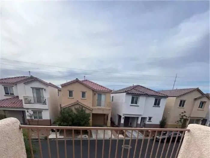 The upstairs has a balcony that overlooks the neighborhood.