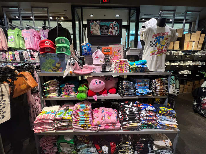 Almost immediately, I was taken aback at how much licensed merchandise was being sold. This table in the front was filled with Nintendo and Sega products.