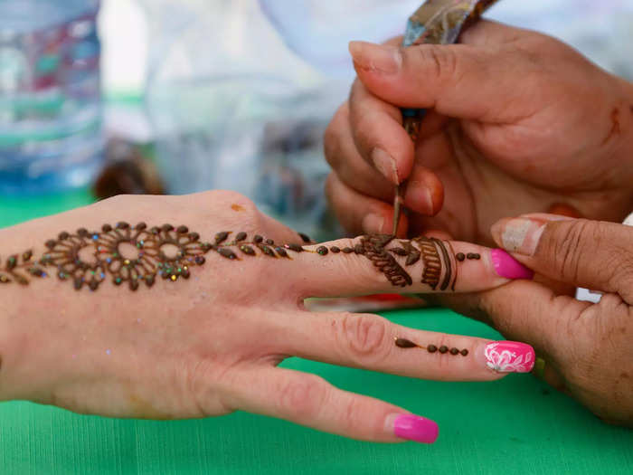 Henna is a natural dye that temporarily stains the skin.