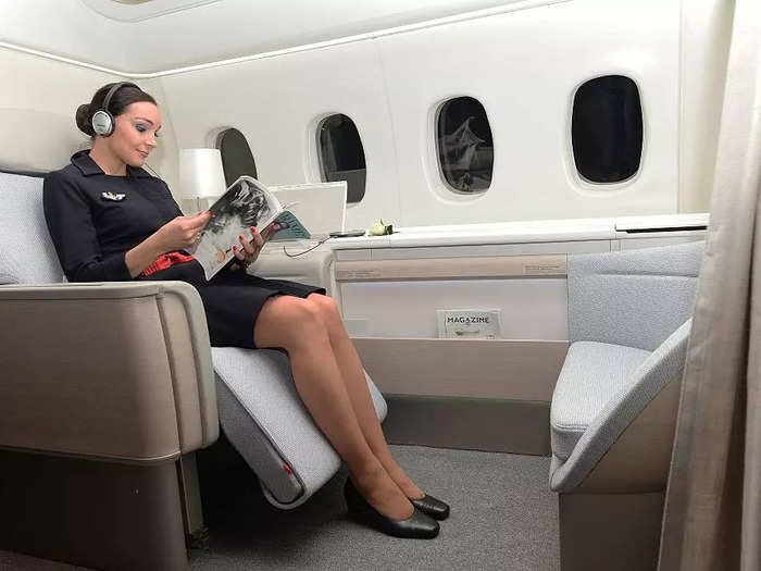 In the 2010s, Air France flight attendants wore simple navy dresses with red sashes.