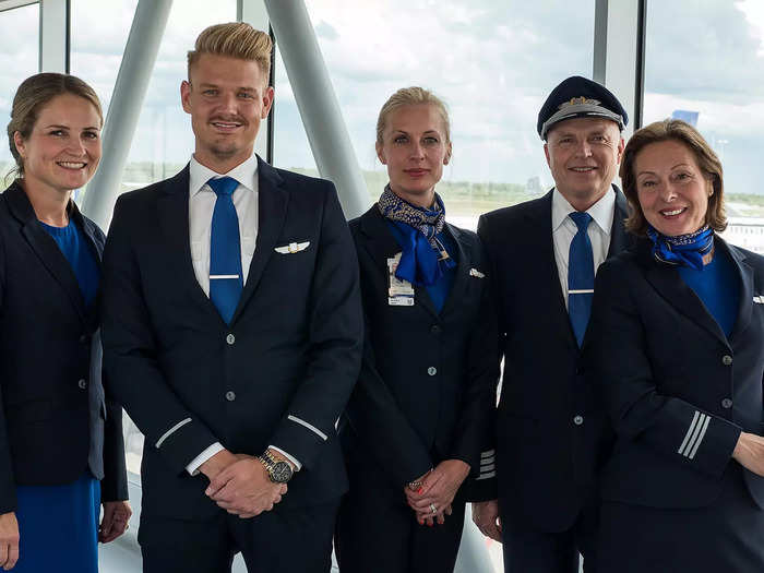 Today, Scandinavian Airlines flight attendants wear navy-blue outfits with royal-blue accents.