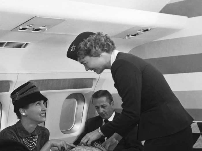 In the late 1950s, Delta flight attendants wore fitted navy-blue blazers with large round buttons.