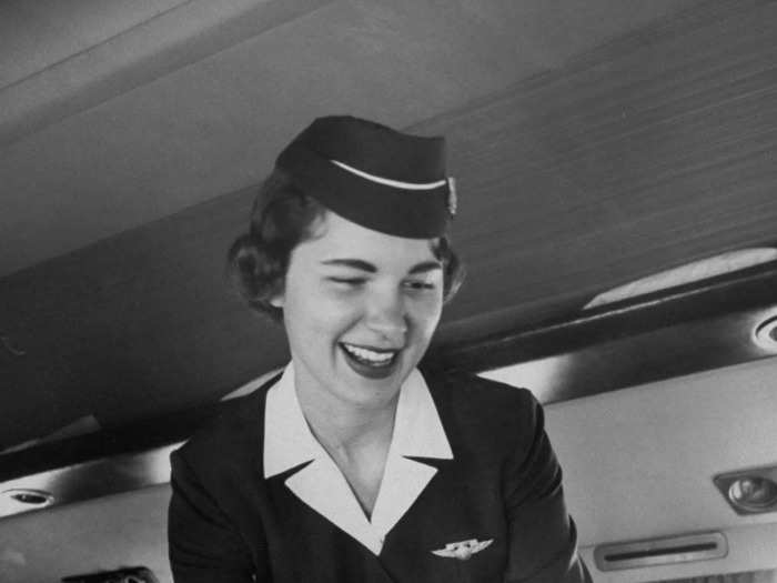 In the 1950s, flight attendants for American Airlines wore crisp navy-blue blazers and skirts.