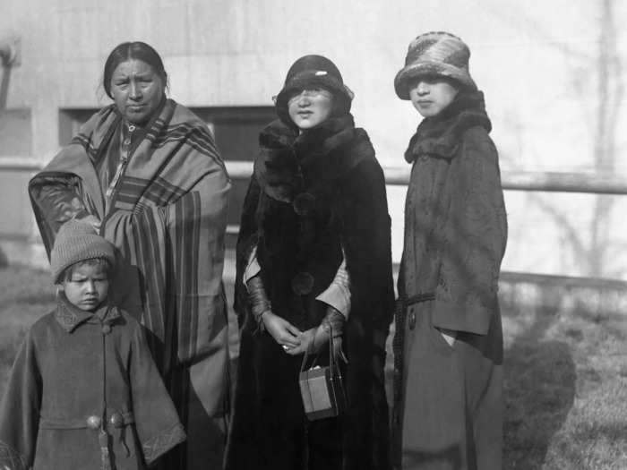 Circa 1920s: Some Osage women chose to dress in a more modern fashion, like Rose Wagoshe (center) and Mary Red Eagle (right). Some, like Mrs. Red Eagle (left) chose traditional clothing.