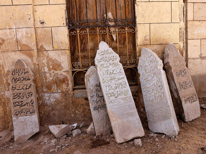 Some tombstones have been removed and then left abandoned on the street.