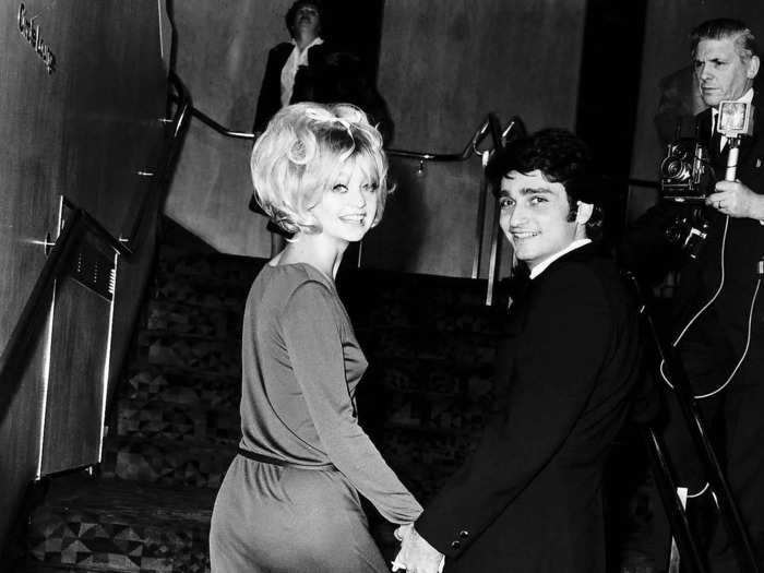 Goldie Hawn and her husband Gus Trikonis held hands as they arrived at a London film premiere on January 30, 1970.