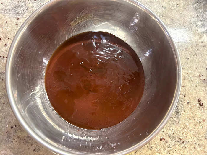 I cooled the melted chocolate by whisking in the sugars.