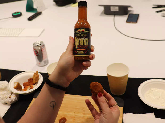 Before eating the final wing, we put a little extra sauce on it per the "Hot Ones" tradition.