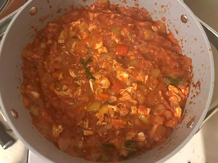 I added the chicken to the chili and continued to let it simmer uncovered. 