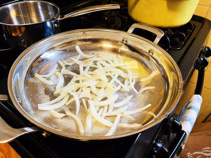 After thinly slicing up a small yellow onion, I added two tablespoons of butter and the onions to a cast-iron pan.