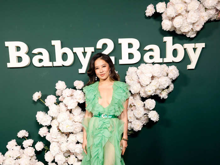 Christine Ko wore a flowing green gown cinched at the waist. 