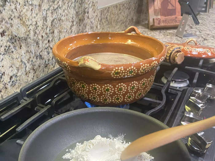 The next step is to add flour or corn masa to thicken the mixture, but toasting it first is what brings out the flavor.