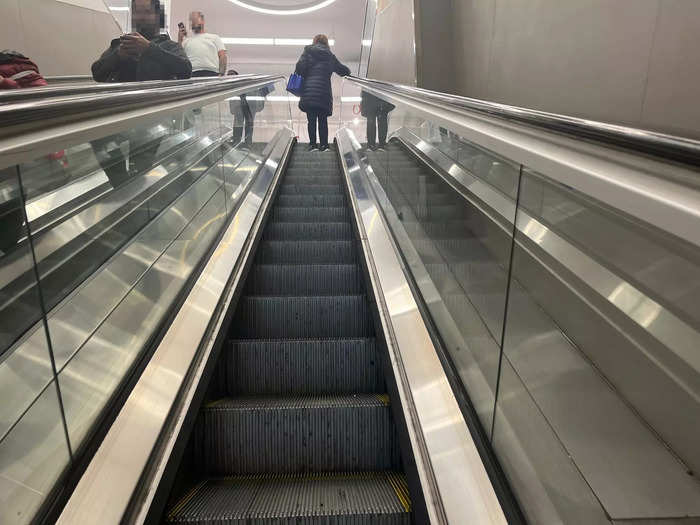 Shoppers take an escalator to reach the 25,000-square-foot store.