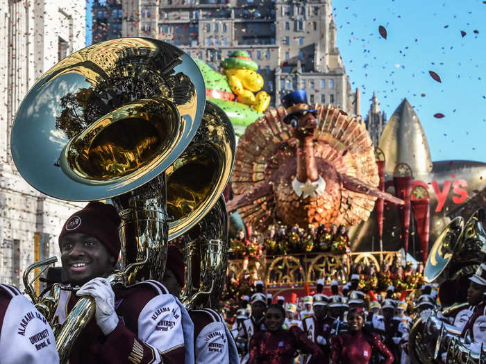 The parade began with a marching band followed by a turkey float.