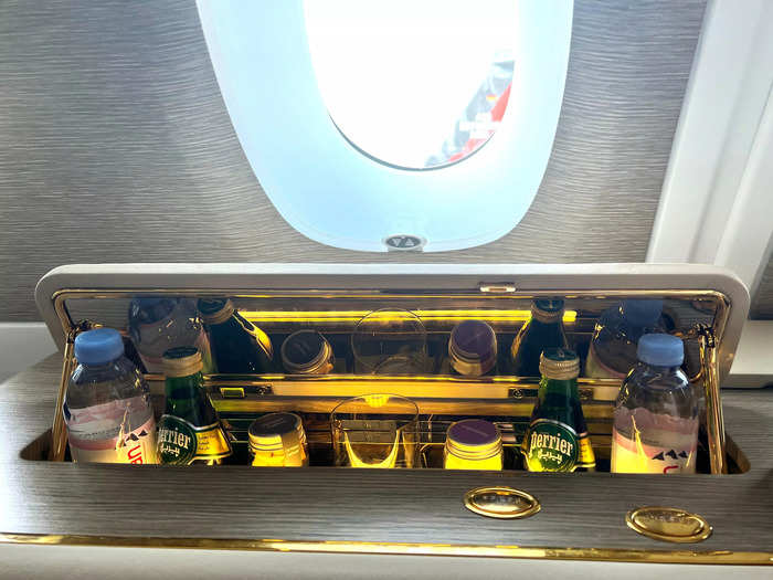 First-class passengers also have a larger minibar, which pops up from underneath the window.