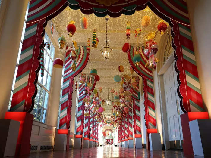 Candy-themed ornaments hang from the ceiling in the East Colonnade.