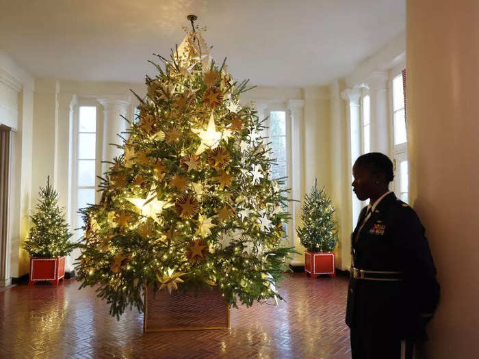The Gold Star tree in the East Wing features wooden star ornaments engraved with the names of fallen soldiers.