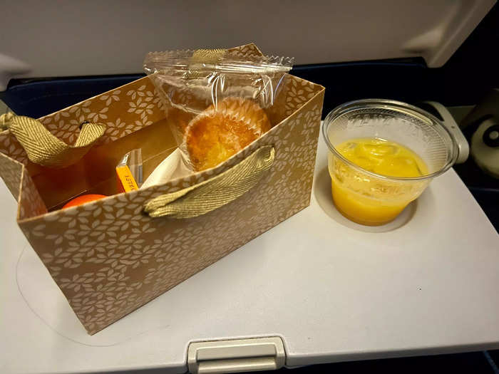 As this was a red-eye flight, the second meal contained mostly breakfast food, including a muffin, orange, cheese, and crackers.