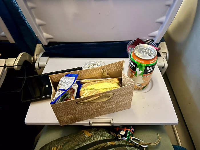 The second meal, consisting of an egg sandwich, juice, and trail mix, was served about 90 minutes before landing.